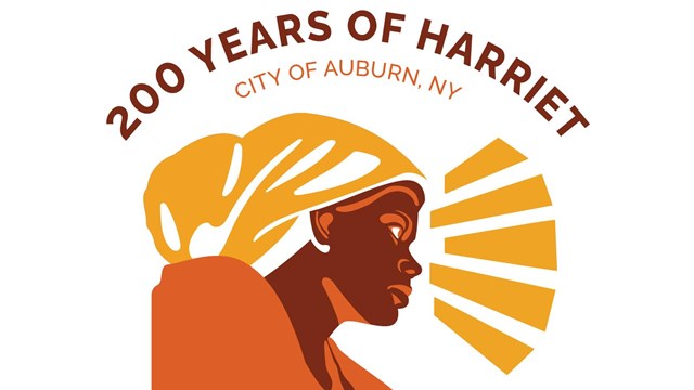 logo shows woman in profile with head covering, rays of light extend from her face
