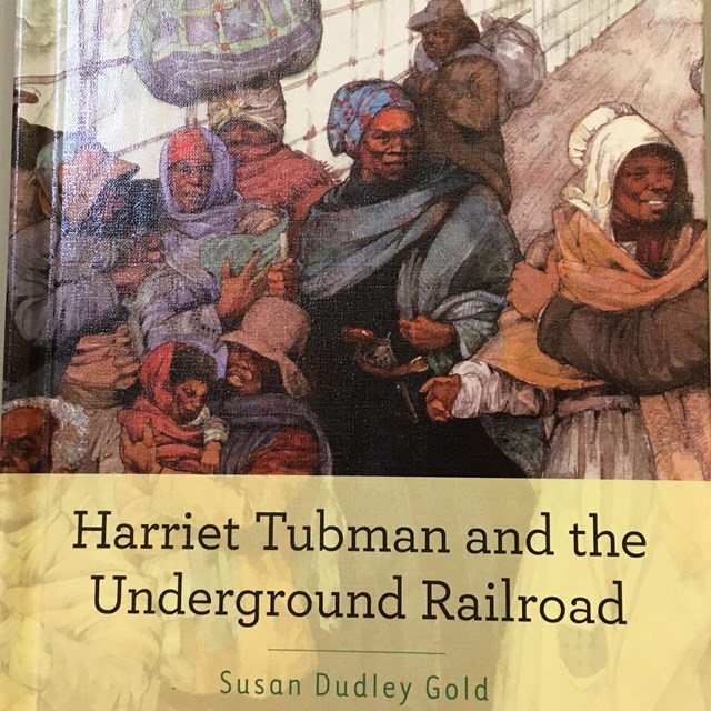 Book cover showing illustration of slaves carrying bundles escaping to freedom