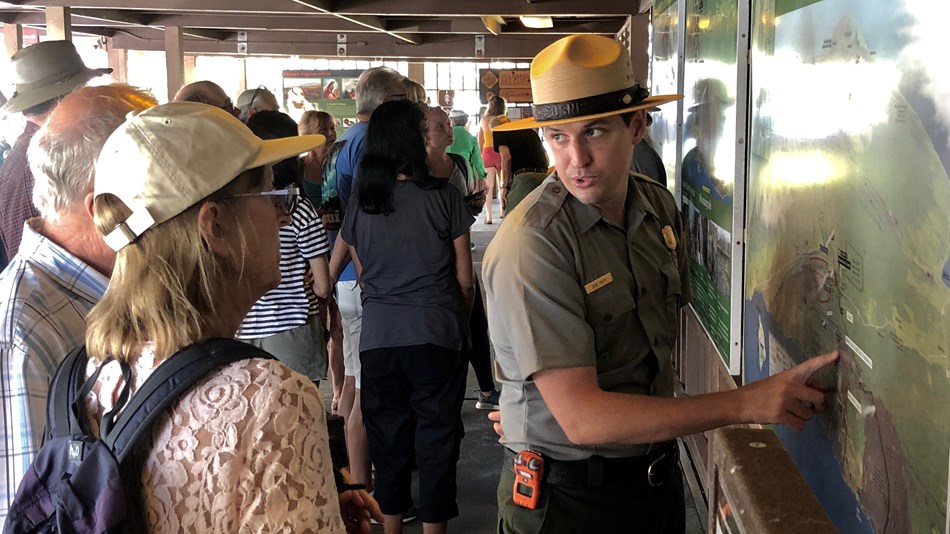 Ranger helping visitors
