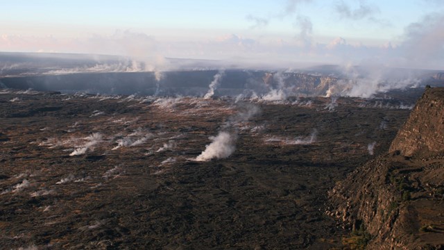 Steaming volcanic caldera