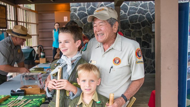 A park ranger and three young children