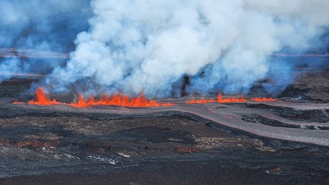 Lava fountaining along the flank of a volcano.