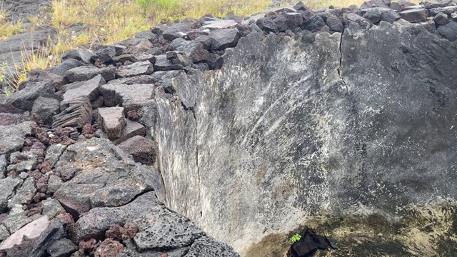 A historic cistern used to collect water in a lava flow field.