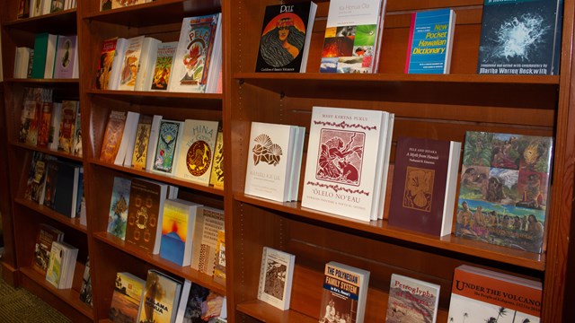 Book shelf lined with books about Hawaiian culture and history