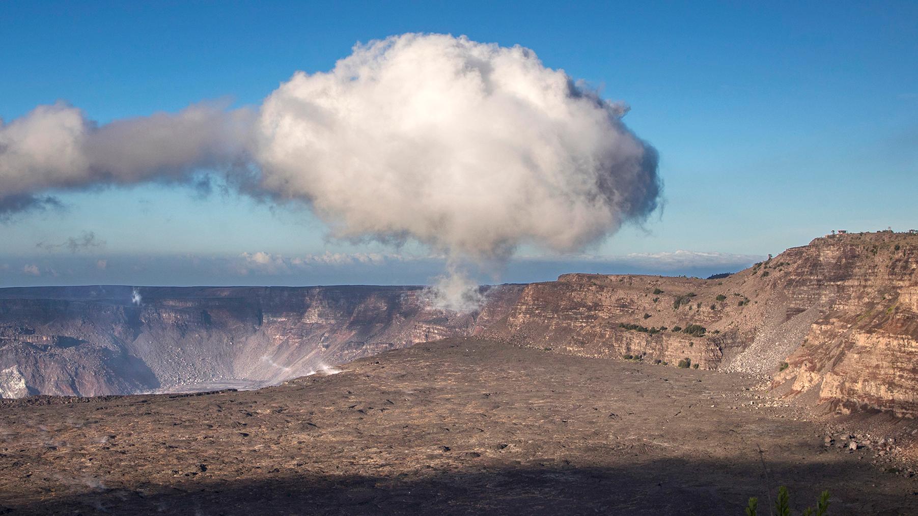 Steam cloud over a volcanic caldera