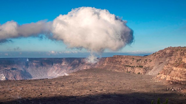 Steam cloud over a volcanic caldera
