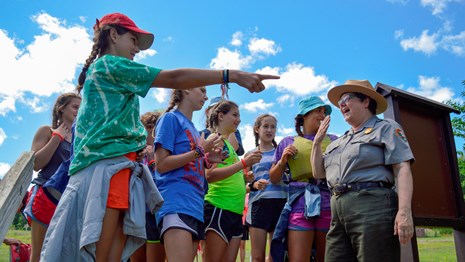Group of girls talking with ranger
