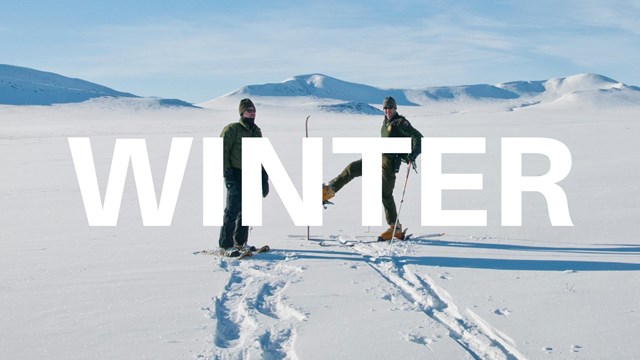 word Winter over background of a skier and snowshoer