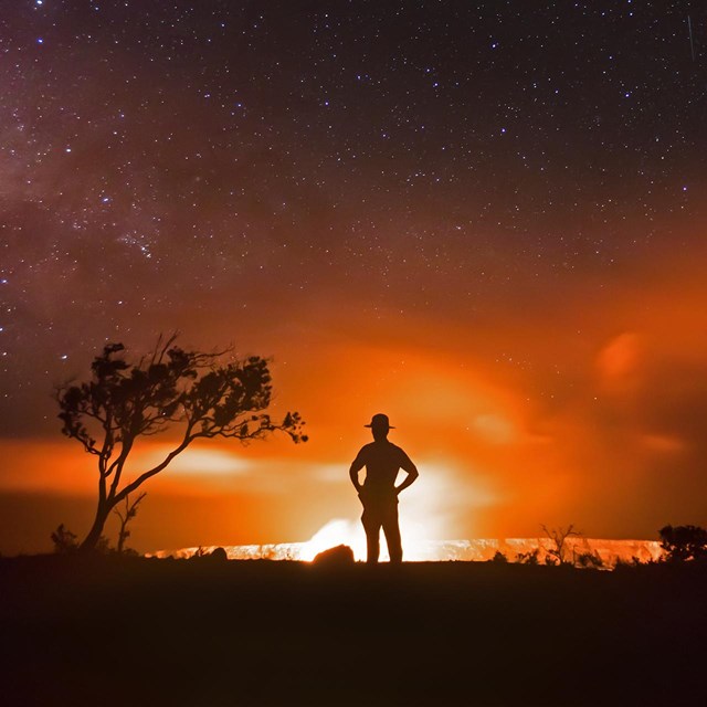 Shadow of ranger in front of volcano