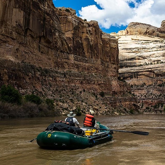 Two men in raft on river