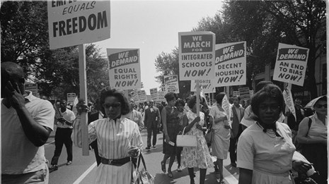 Women protesting with signs.