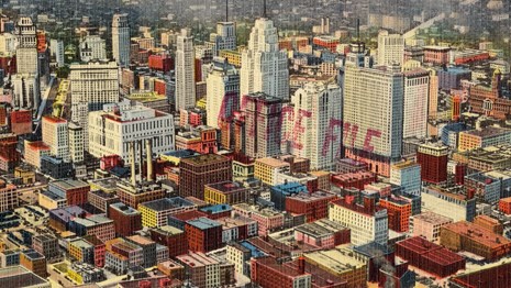 Historic postcard of downtown buildings.