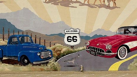Mural of cars with Route 66 sign.