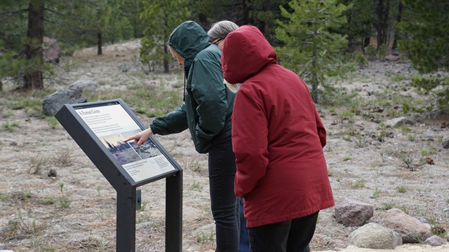 Hikers reading about Devastated Area