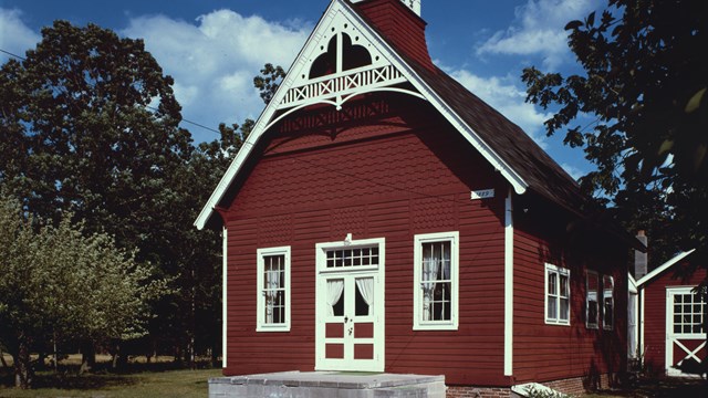 Red one-room school house with white trim in Cape May, New Jersey