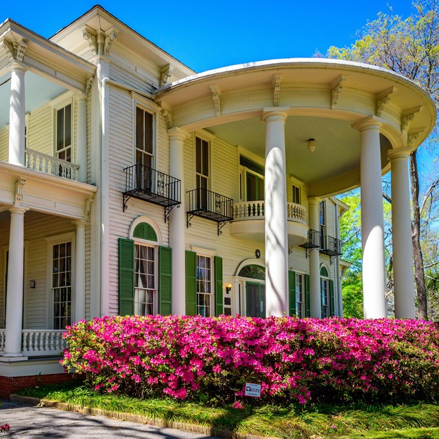 A large white house with pillars 