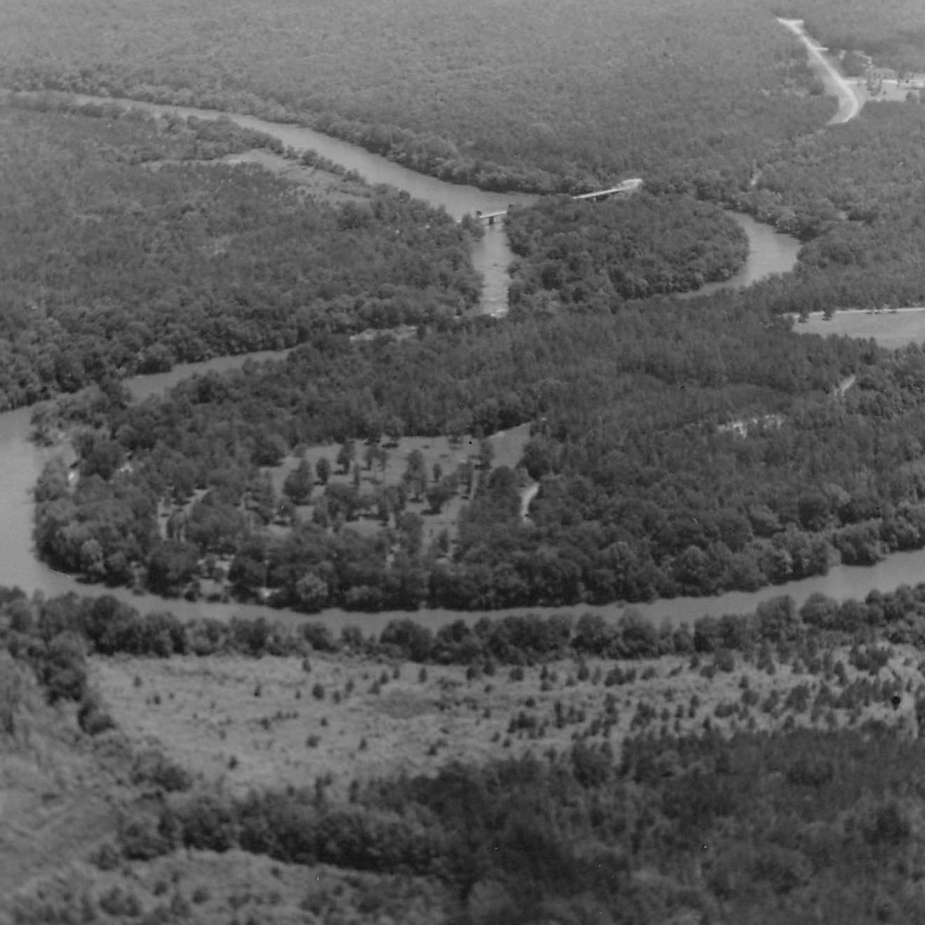aerial black and white photo of the horseshoe-shaped bend of the river