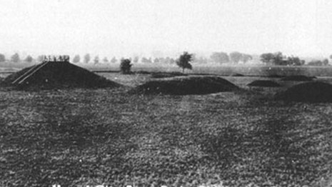 An old black and white photo of mounds