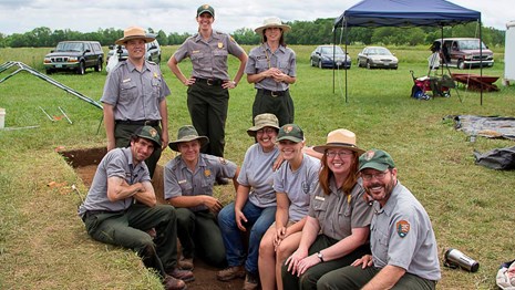 Park employees post for a photo