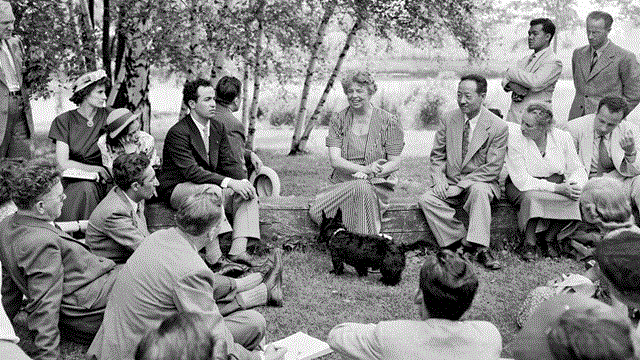 Eleanor Roosevelt, entertains UNESCO visitors on the grounds of her home in Hyde Park, NY.
