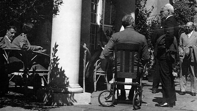 FDR seated in a wheelchair on the terrace of Springwood.