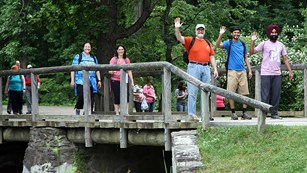 A group of people walking on a road.