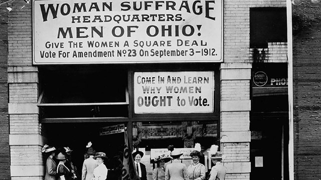 Women gathered outside of the Woman Suffrage Headquarters in Ohio