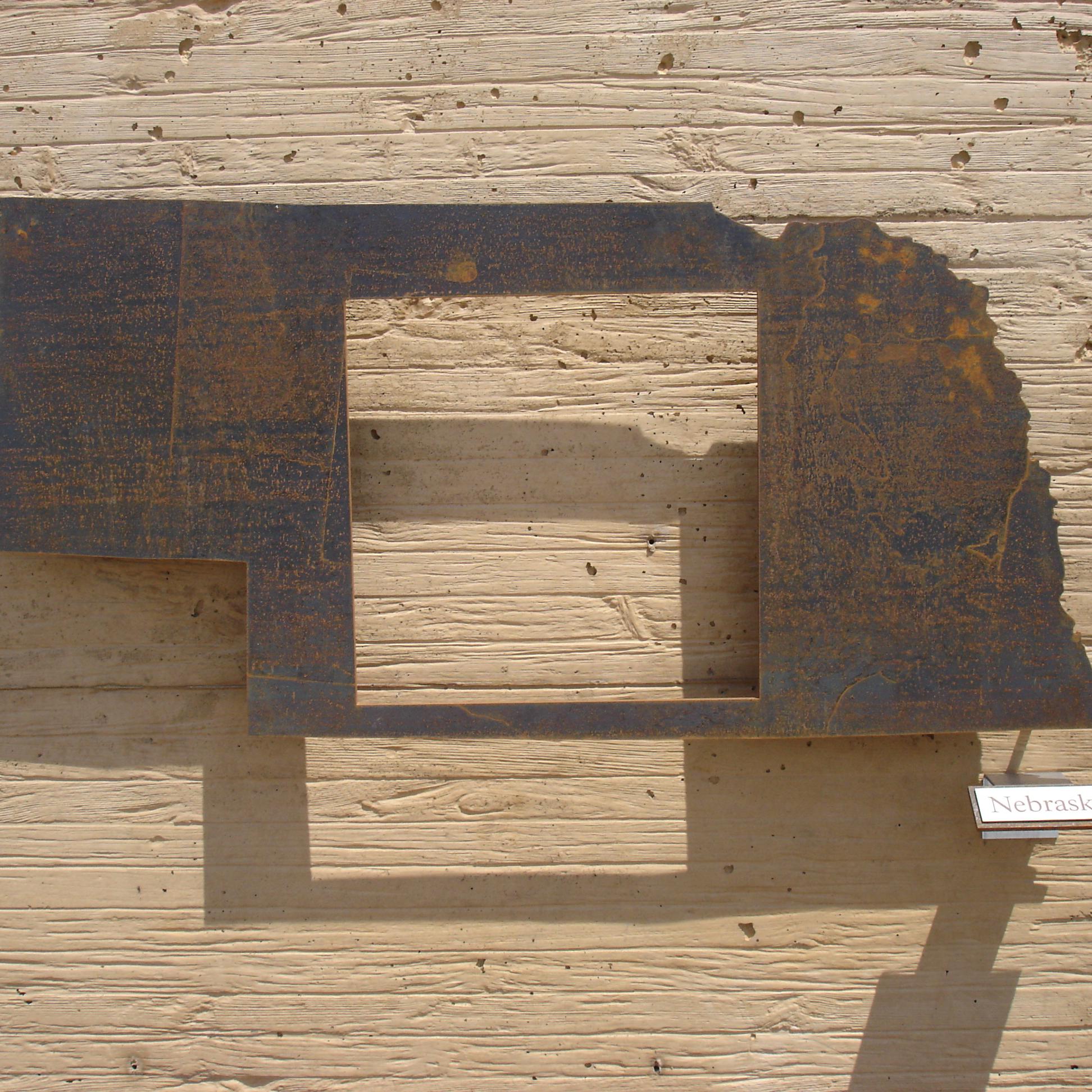 Cutout in the shape of Nebraska with a cutout showing the amount of homesteaded land