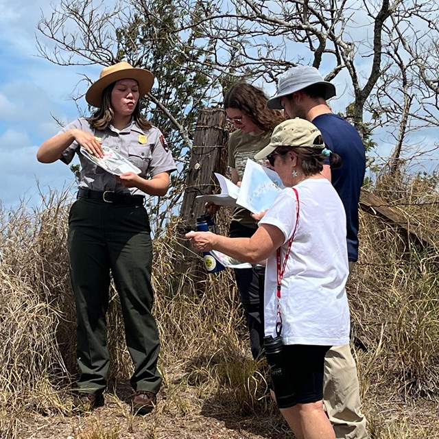 A park ranger talking to a group of visitors
