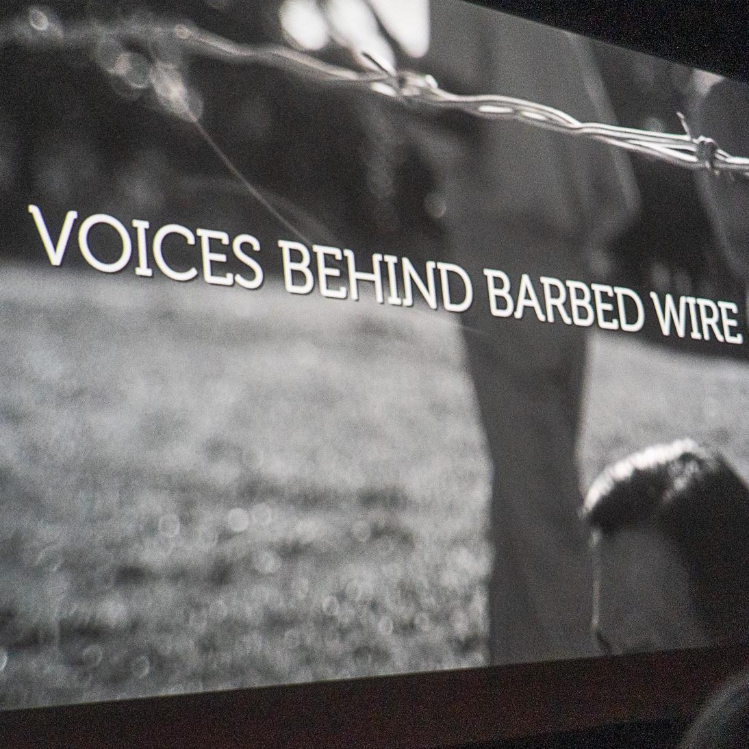 A black and white shot of a movie screen with the title 