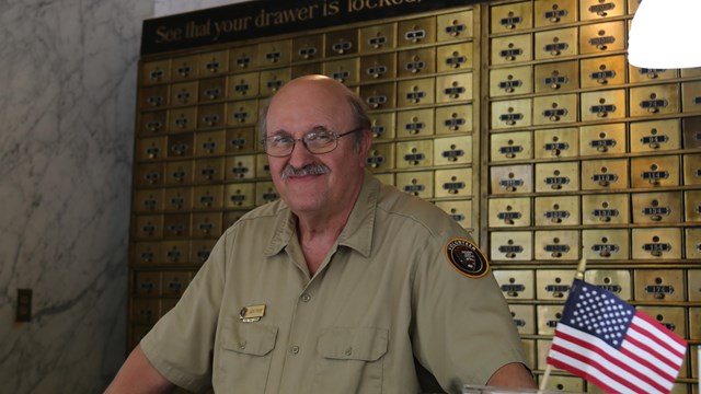 A volunteer staffing the visitor center front desk