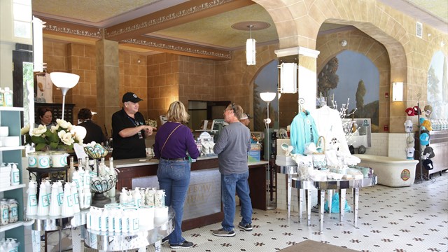 Visitors making a purchase at the park store