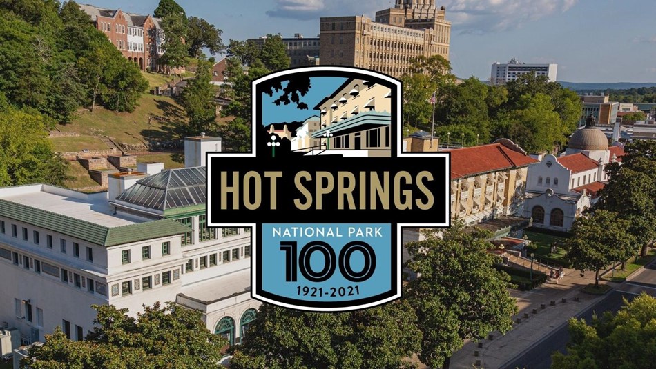 Aerial view of downtown Hot Springs. Logo with the text 