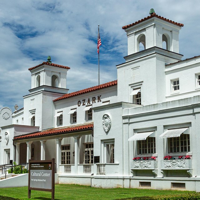 The Ozark Bathhouse features white stucco and has sharp edges. 