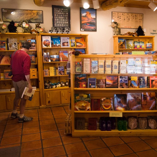 several shelves stand in a bookstore