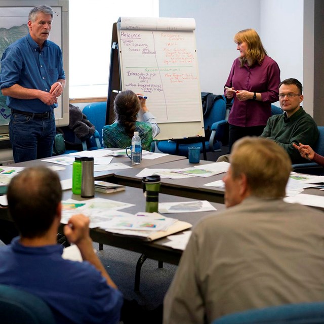 A group of people in a meeting room.