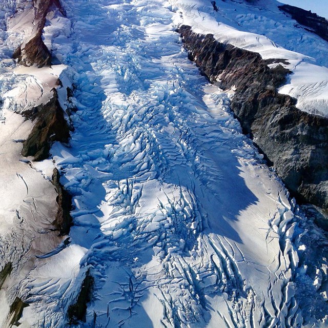 A close up of a glacier surface.
