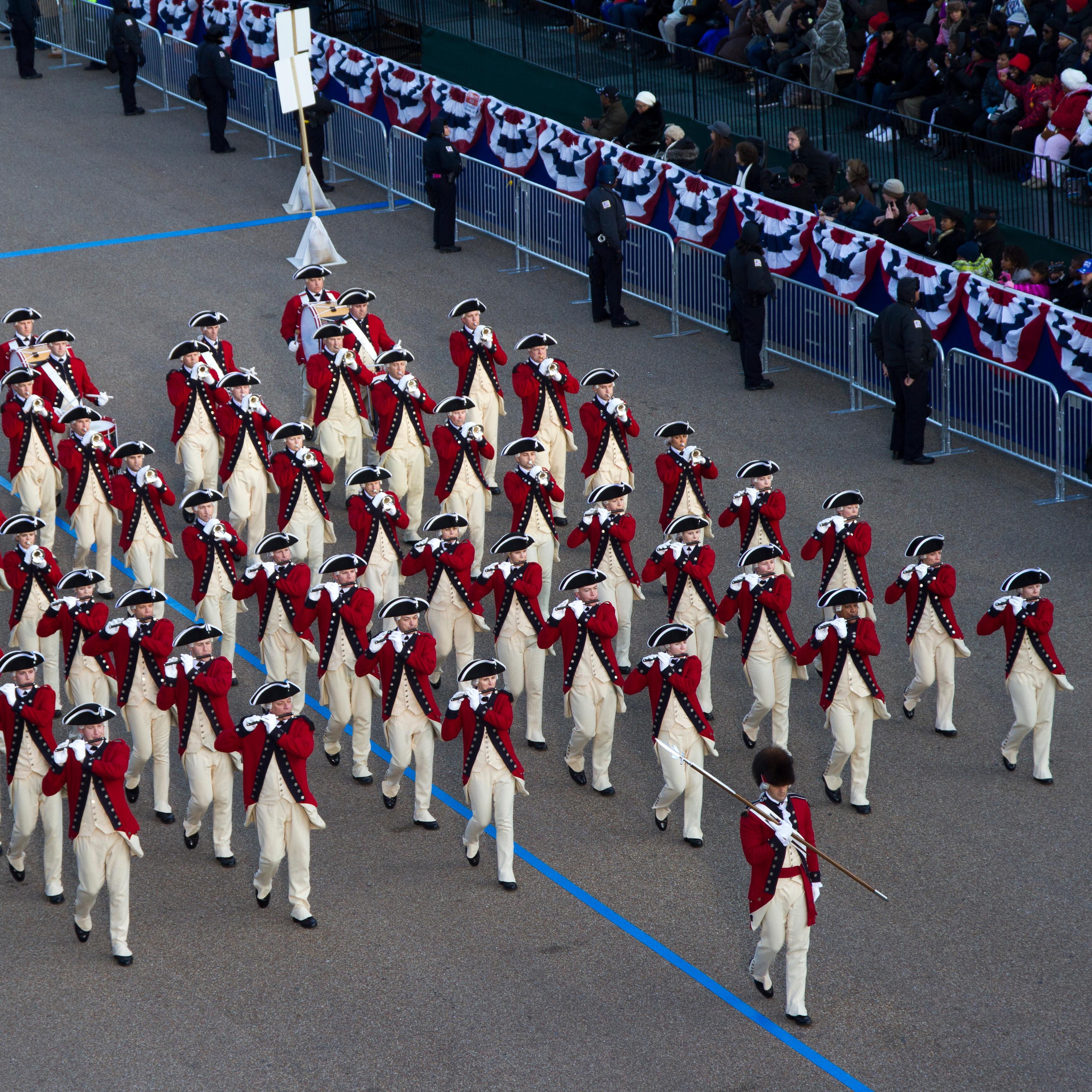 Military fife and drum core wearing traditional 18th-century uniforms