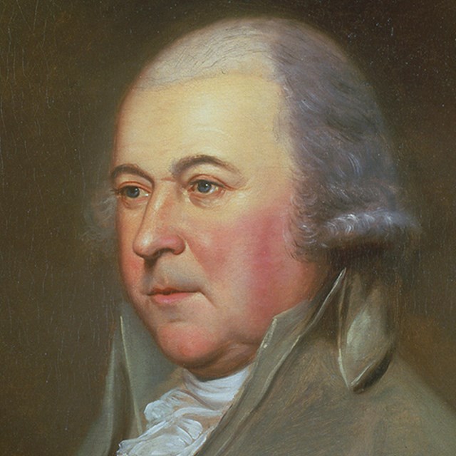 Color portrait of John Adams, showing gray-white hair and blue eyes.