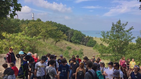 Students overlooking Lake Michigan along the sandy Cowles Bog Trail