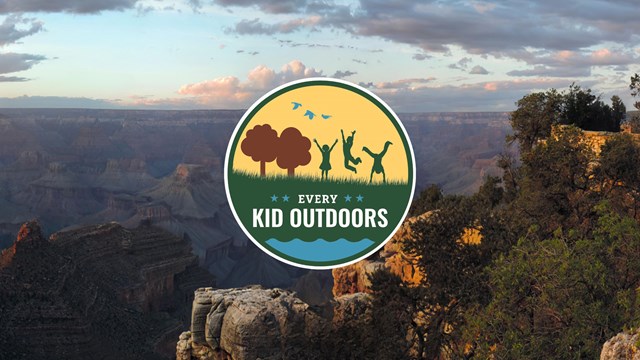 Every Kid Outdoors logo hovering over photo of the Grand Canyon.