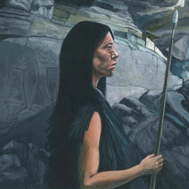 Native American Indian woman standing in cave looking outside.