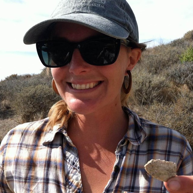 Archeologist with island artifact