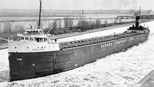 SS Emperor breaking ice as it arrives in port