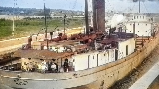 SS Glenlyon docked with crew aboard, image colorized