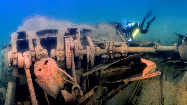 diver exploring SS Glenlyon wreckage