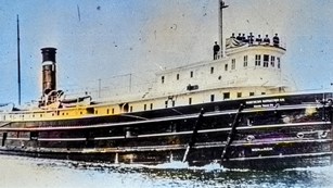 SS Monarch with crew looking on from top deck