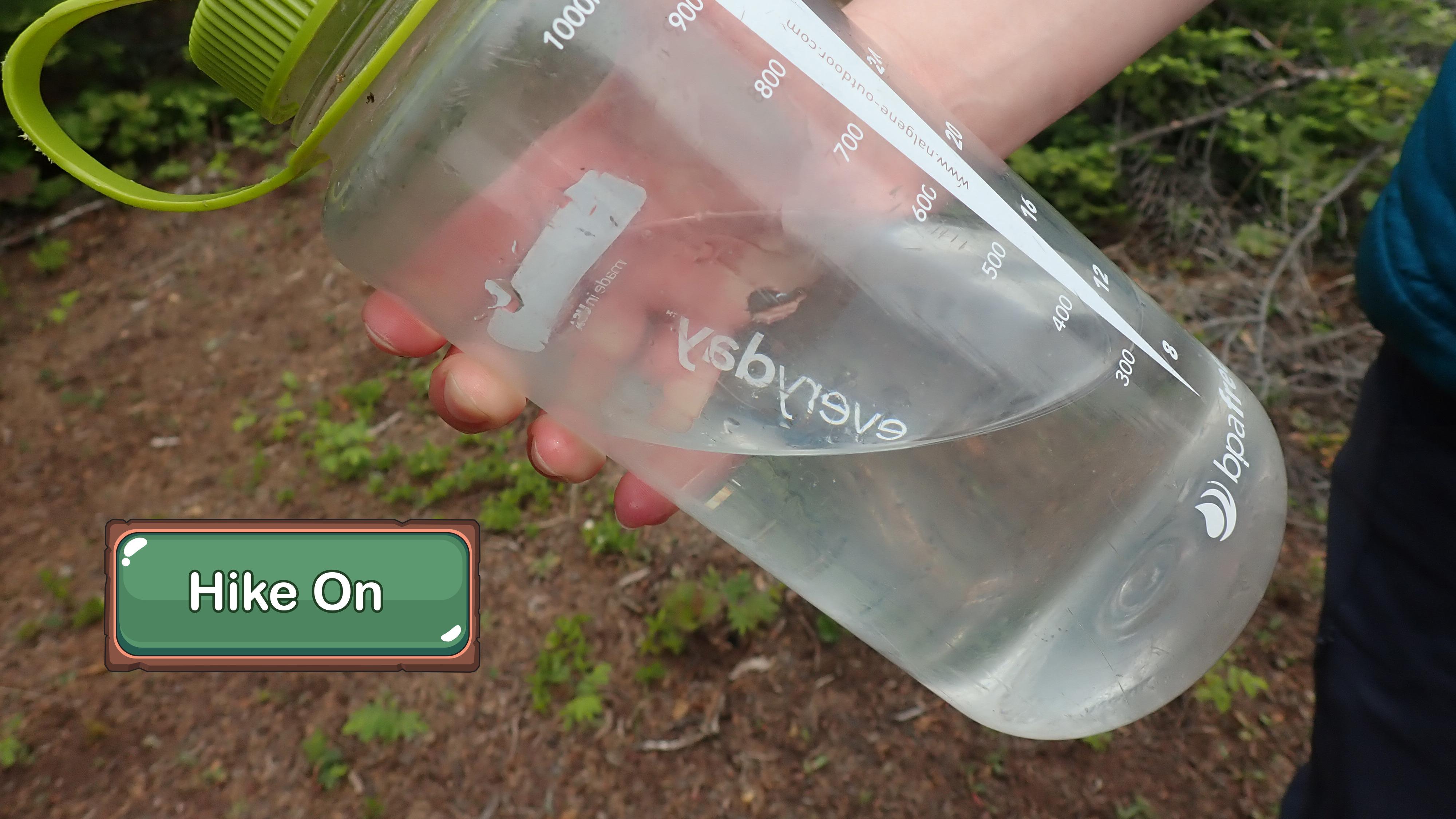Close up of a half-full water bottle.