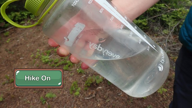 Close up of a half-full water bottle.