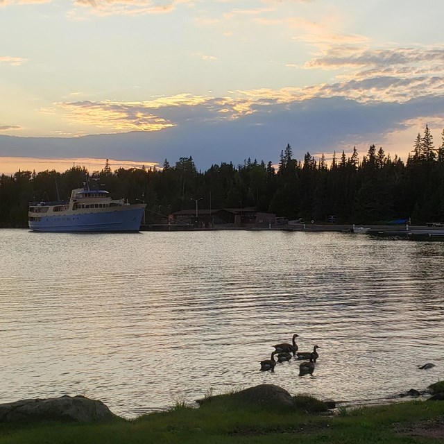 Sunset at the Rock Harbor marina with the Ranger III in the distance.